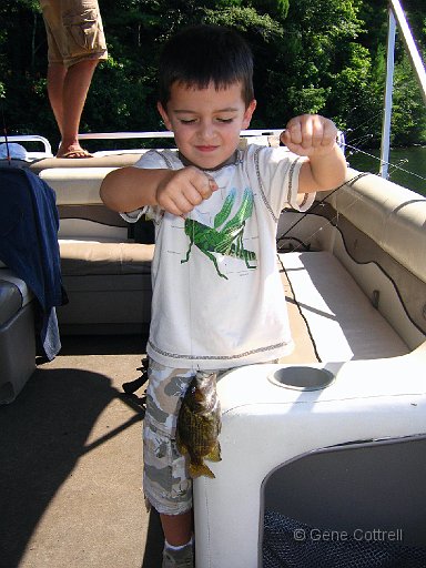 MaxFish.jpg - Max with a rock bass. He had a big one on, but it went under the boat.